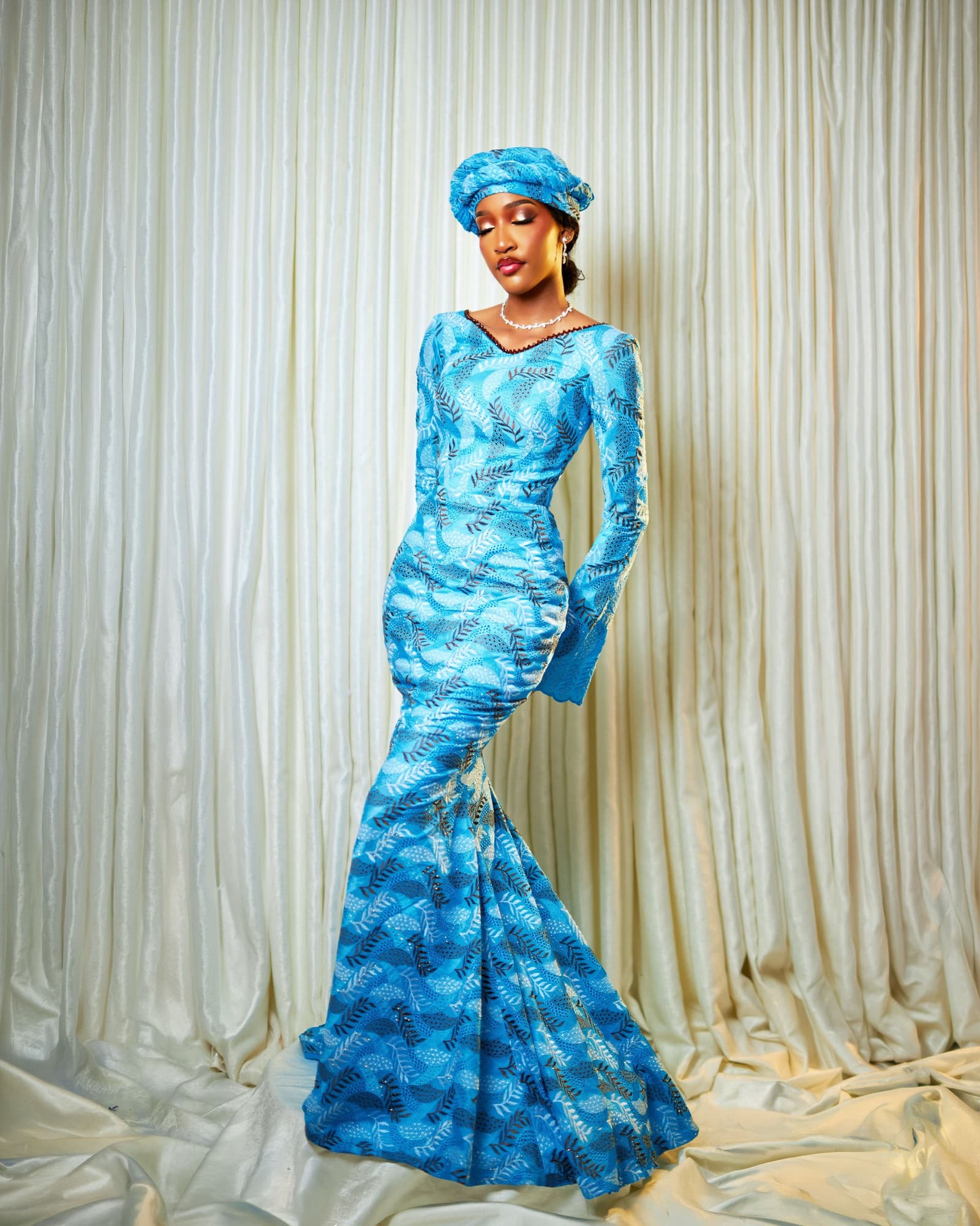 Bluethopia in a blue patterned mermaid gown